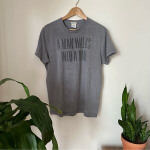 Free w purchase ✨ “A MAN WALKS INTO A BAR” Grey Graphic Tee
